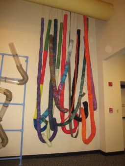 • Wonderlab Weavings • 2011 • 30 ‘ H x 20’ W • 100% cottons, cable wire, Velcro, pvc pipe • I created this textile installation with a grant from the Indiana Arts Commission. The children’s museum guests interacted with the textile tubes. • Hand-dyed and sewn fabric tubes • Copyright belongs to Daren Redman